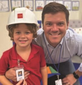 Irvine blurred school name on shirt badge from issue at 299