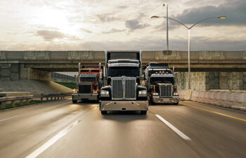 American style truck on freeway pulling load. Transportation theme. 3D illustration